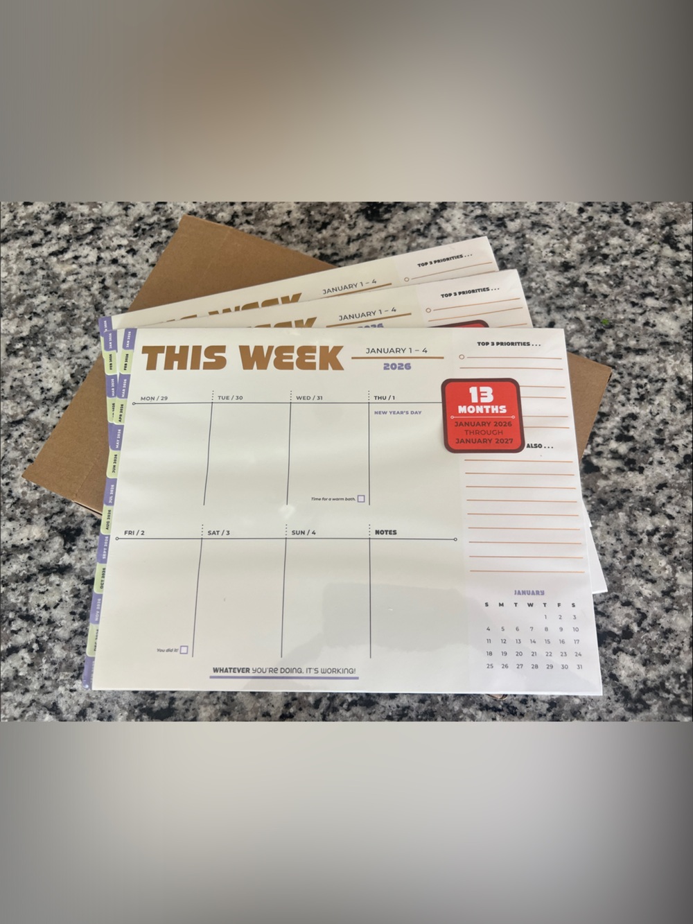 3 Knock Knock This Week Desk Planner Pad — Beige, Purple & Gold accents.